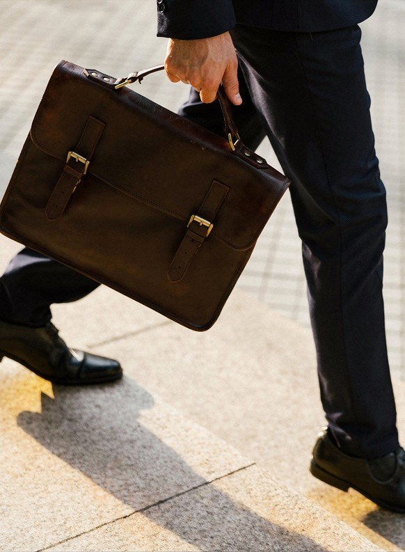 Executive walking with a briefcase